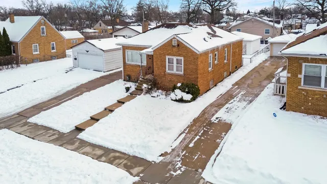 a view of a house with a snow in the background