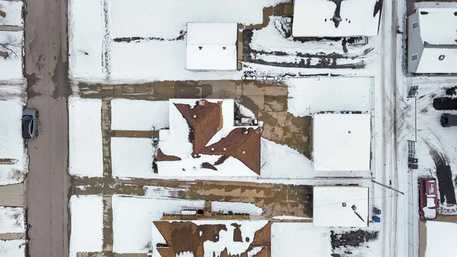 an aerial view of a house with outdoor space