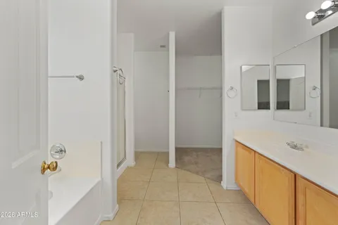 a bathroom with a tub and shower