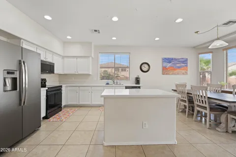 a kitchen with cabinets a sink and appliances
