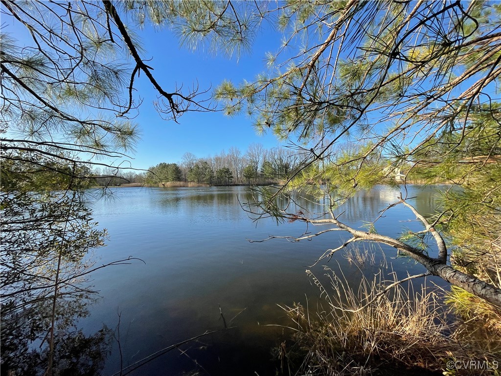 a view of a lake with a building in the background