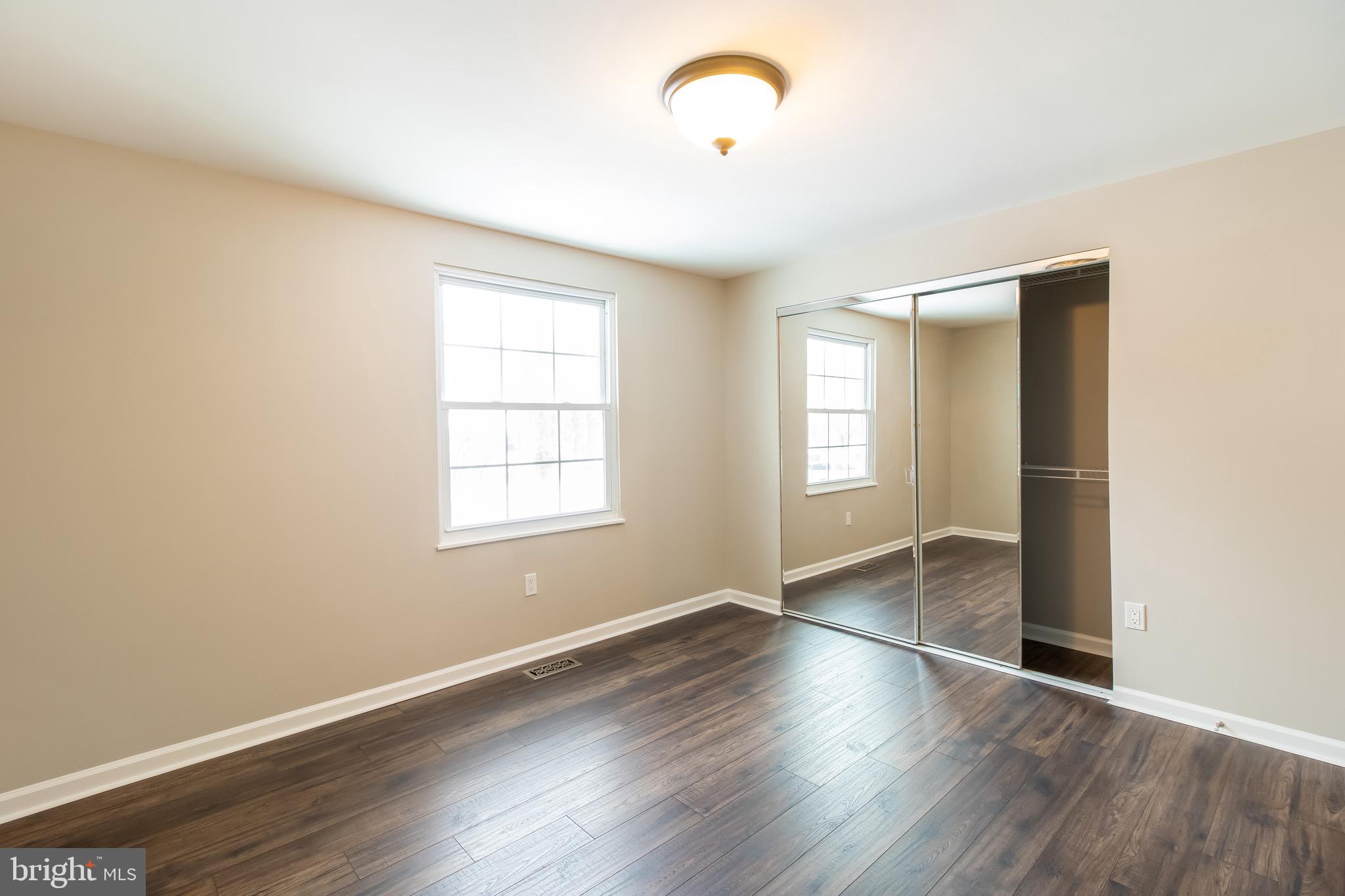 15424 Wembrough Street Silver Spring, MD 20905 - Photo 22 of 40 Upper level bedroom with closet built-ins