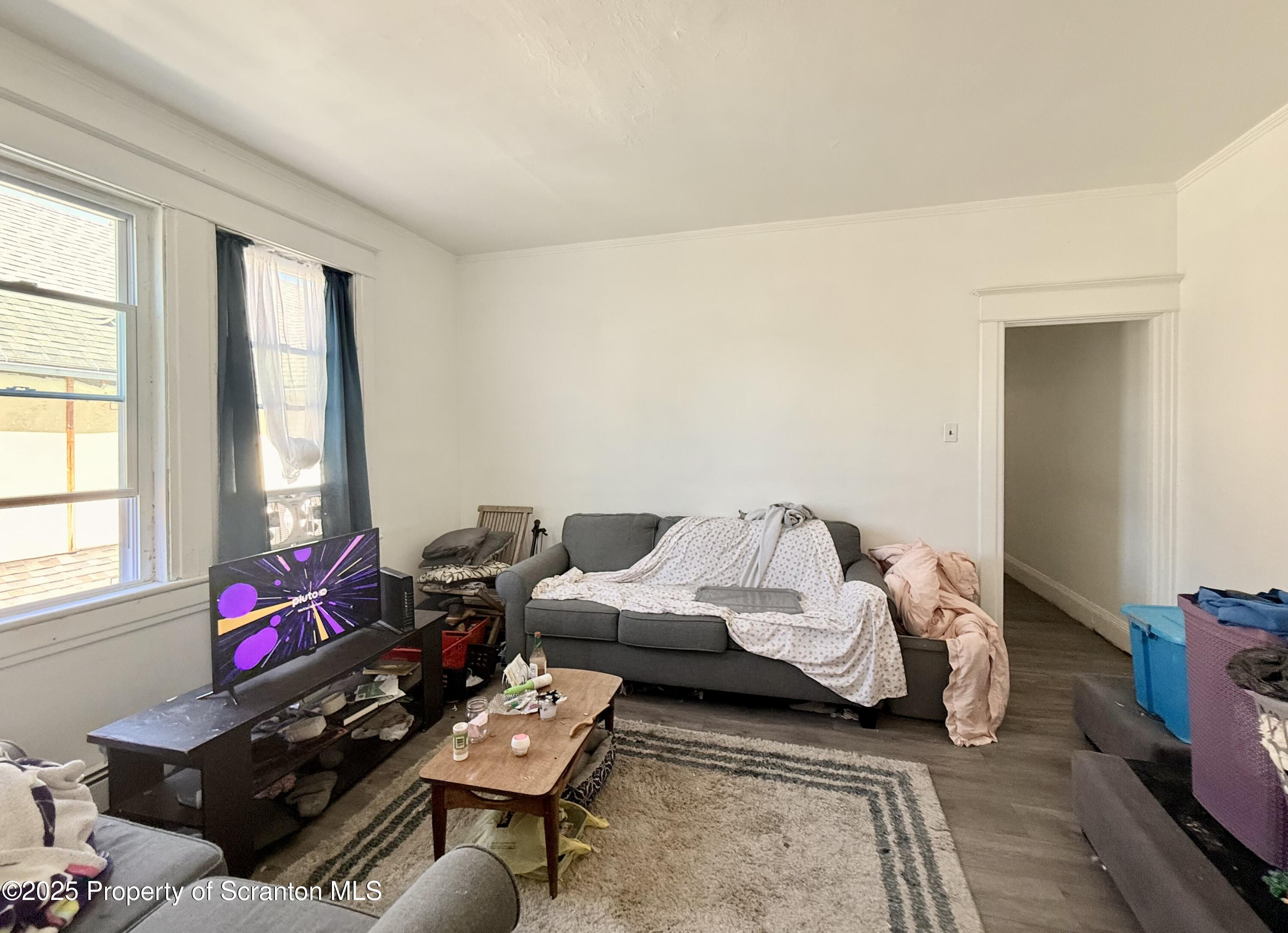 210 Mary Street Olyphant, PA 18447 - Photo 12 of 14 a bedroom with furniture and a window