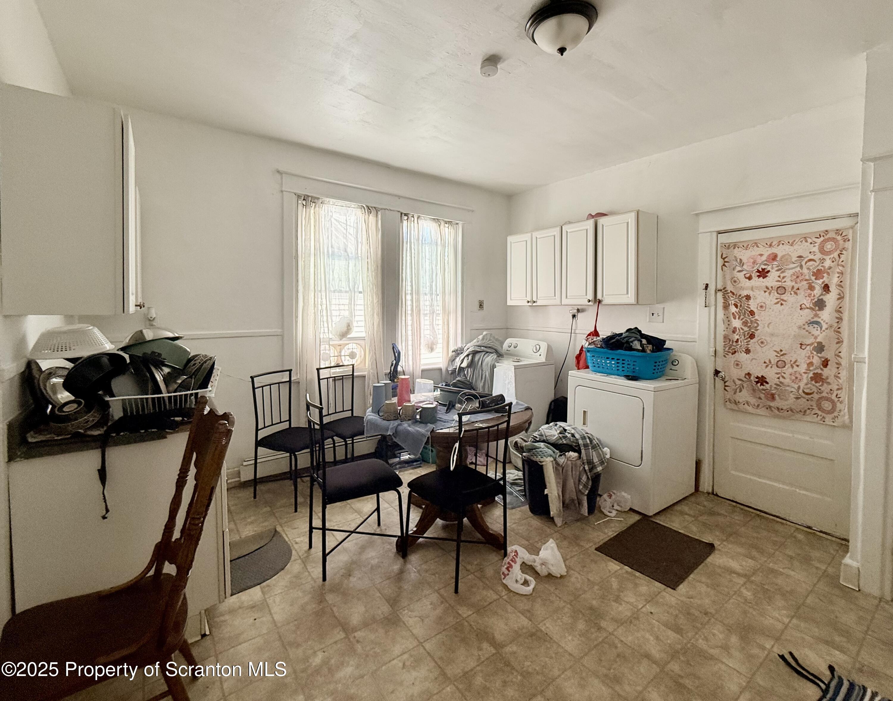 210 Mary Street Olyphant, PA 18447 - Photo 14 of 14 a living room with furniture a rug and a window
