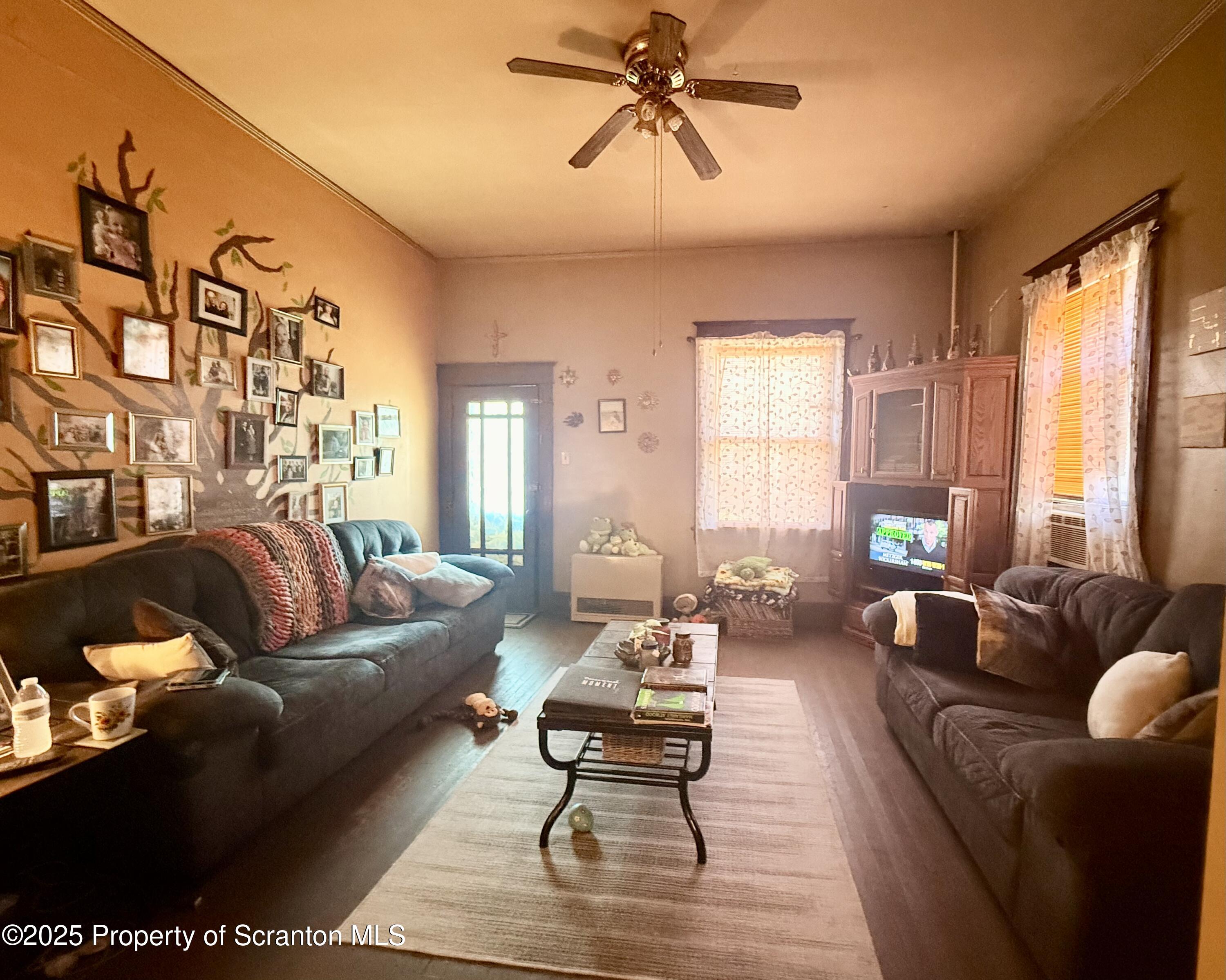210 Mary Street Olyphant, PA 18447 - Photo 2 of 14 a living room with furniture wooden floor and a table