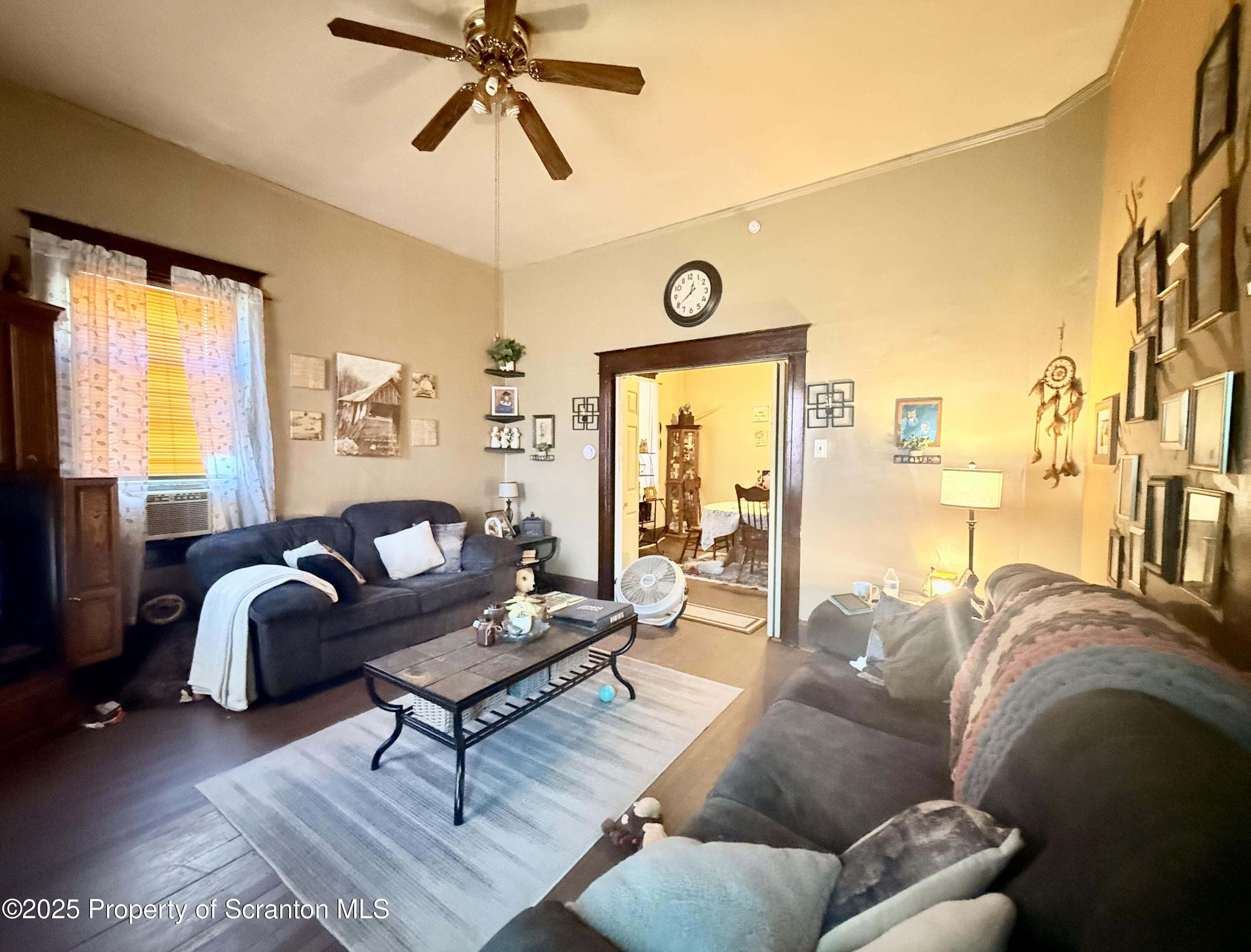 210 Mary Street Olyphant, PA 18447 - Photo 3 of 14 a living room with furniture and a large window