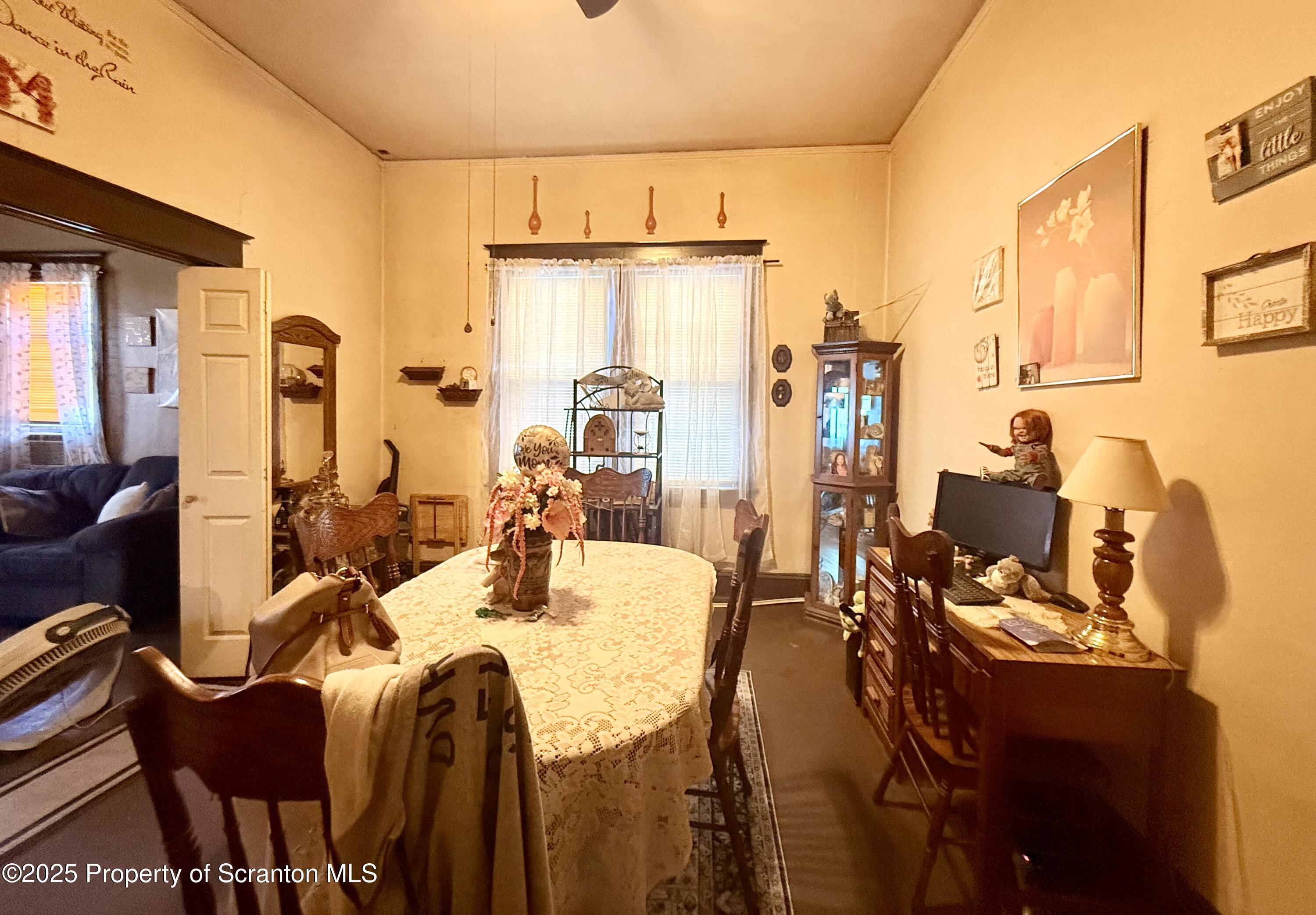 210 Mary Street Olyphant, PA 18447 - Photo 6 of 14 a view of a dining room with furniture and a chandelier