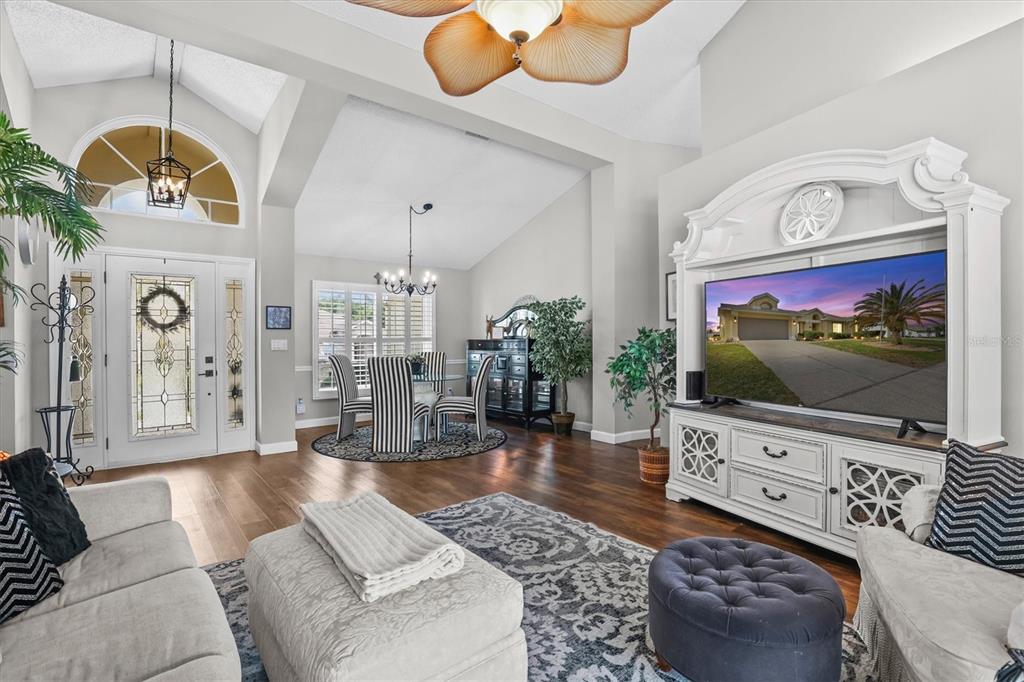 1049 Larkin Road Spring Hill, FL 34608 - Photo 12 of 64 a living room with furniture and a flat screen tv