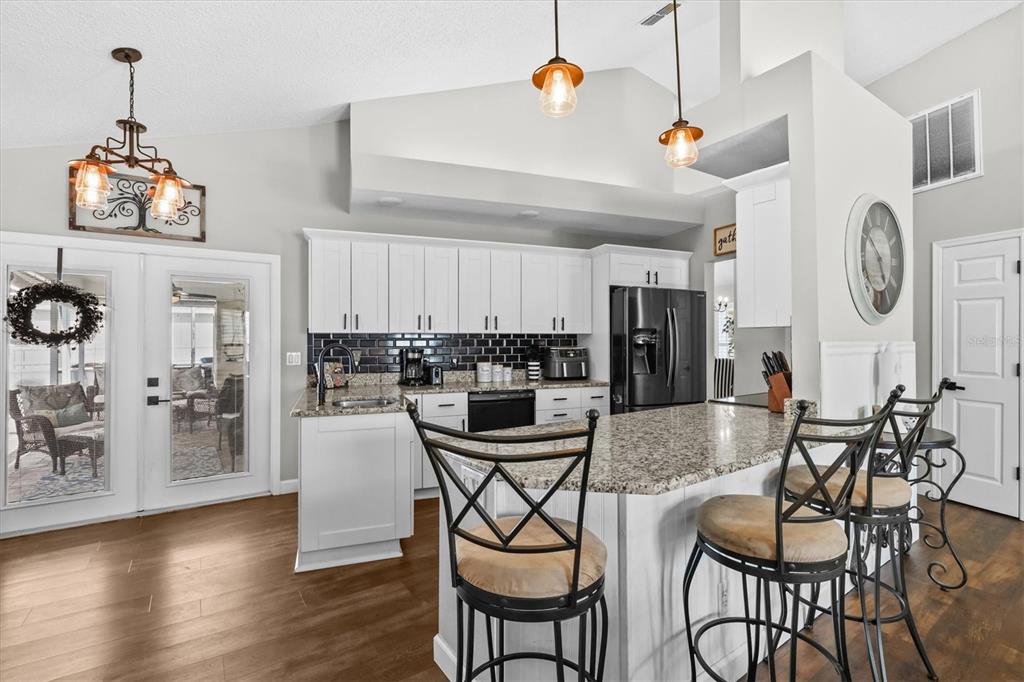 1049 Larkin Road Spring Hill, FL 34608 - Photo 21 of 64 a dining table with chairs and wooden floor