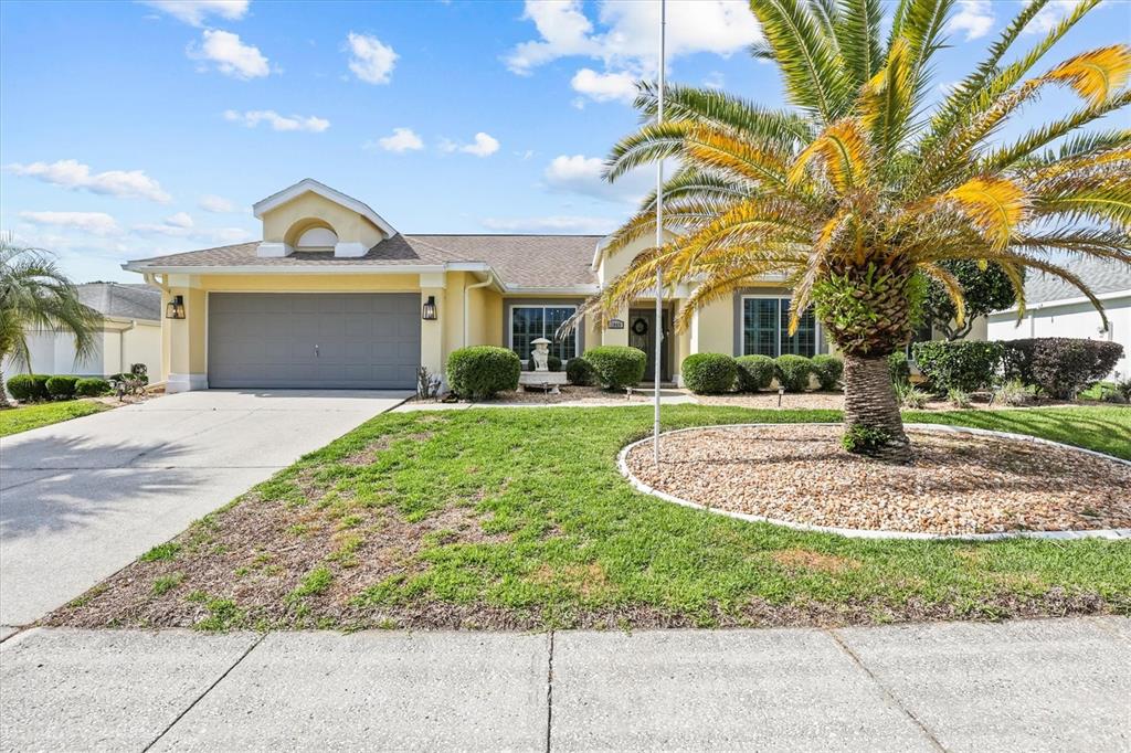 1049 Larkin Road Spring Hill, FL 34608 - Photo 3 of 64 a front view of a house with a yard and garage
