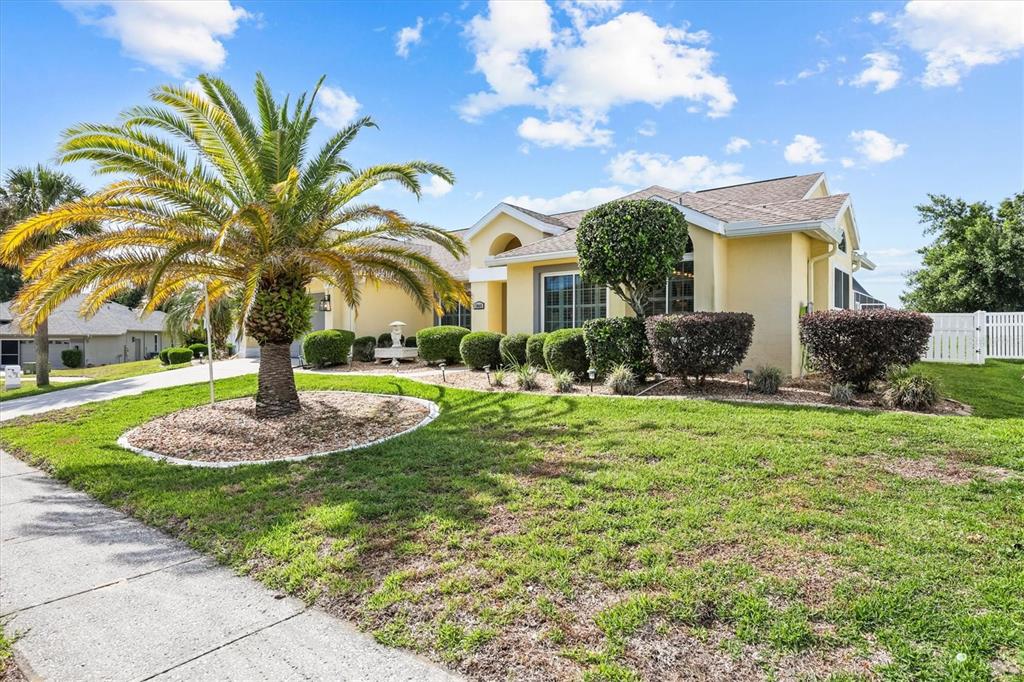 1049 Larkin Road Spring Hill, FL 34608 - Photo 4 of 64 a front view of a house with garden