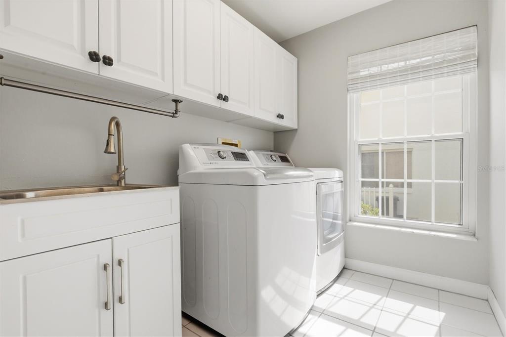 1049 Larkin Road Spring Hill, FL 34608 - Photo 43 of 64 a utility room with dryer and washer
