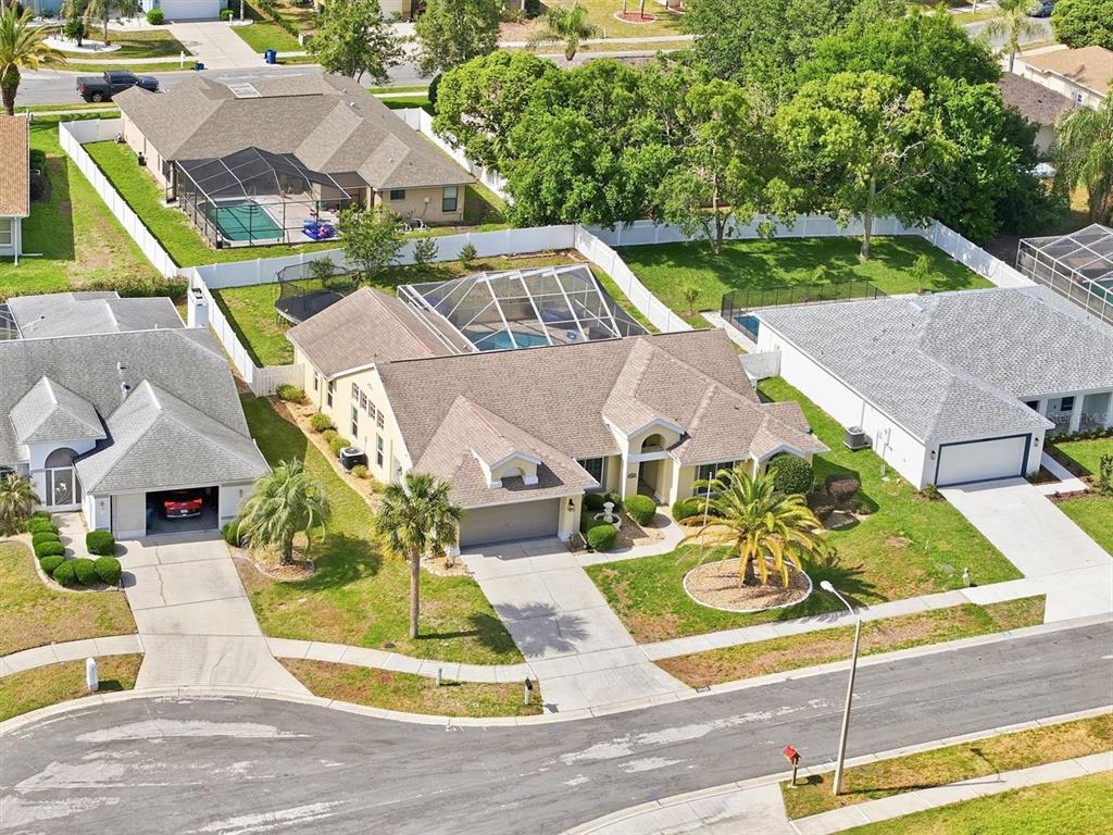 1049 Larkin Road Spring Hill, FL 34608 - Photo 5 of 64 an aerial view of a house with garden space and street view