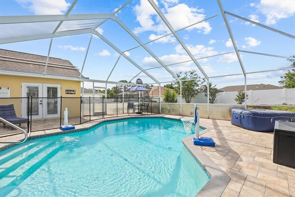 1049 Larkin Road Spring Hill, FL 34608 - Photo 53 of 64 a view of a swimming pool with a patio