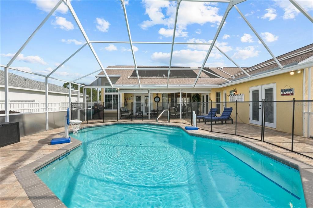 1049 Larkin Road Spring Hill, FL 34608 - Photo 54 of 64 a view of a backyard with table and chairs with wooden floor and fence
