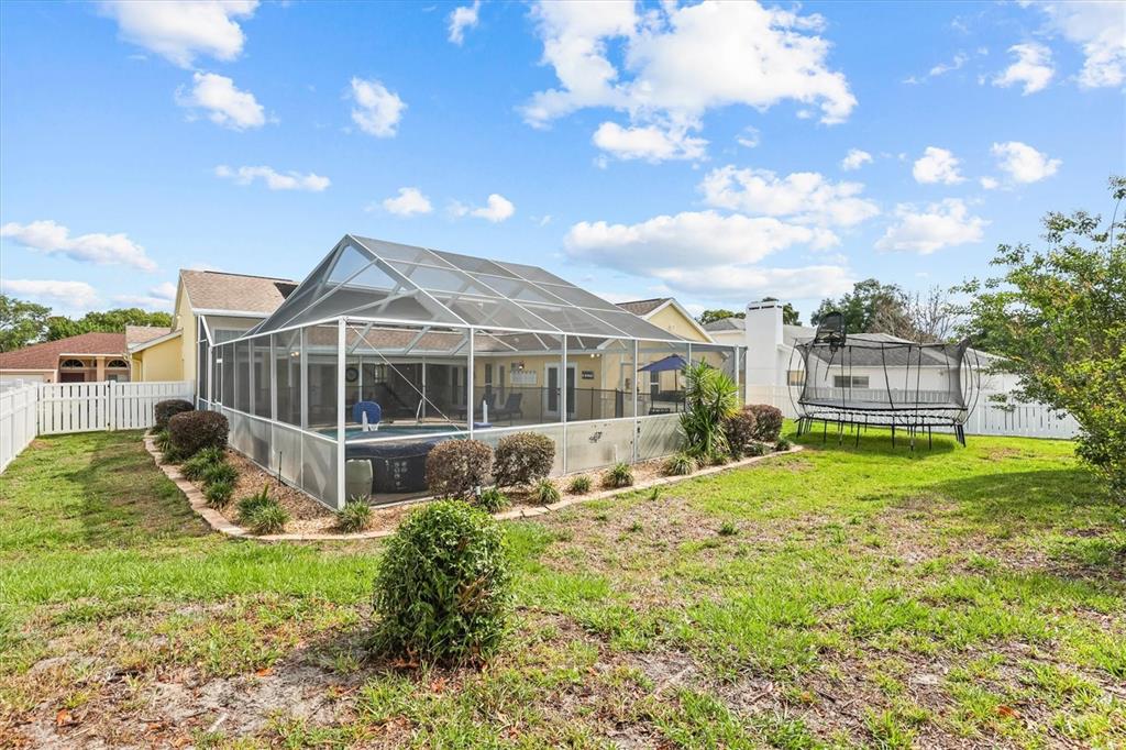 1049 Larkin Road Spring Hill, FL 34608 - Photo 57 of 64 a house view with a garden space