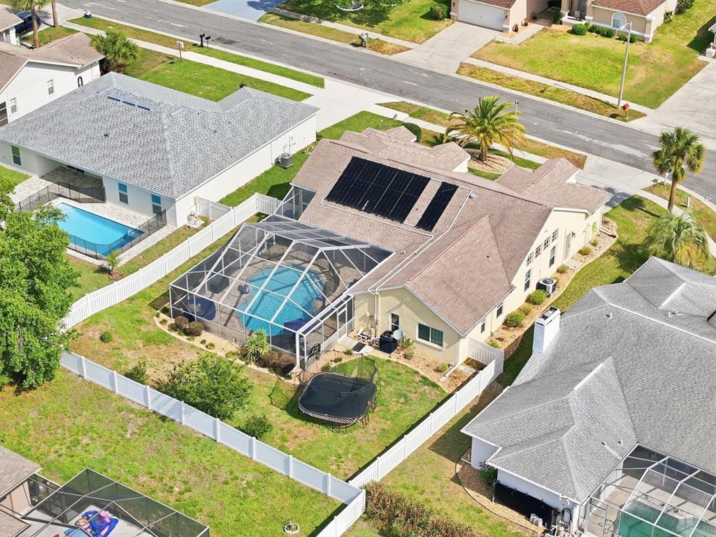 1049 Larkin Road Spring Hill, FL 34608 - Photo 59 of 64 an aerial view of a house a garden and swimming pool