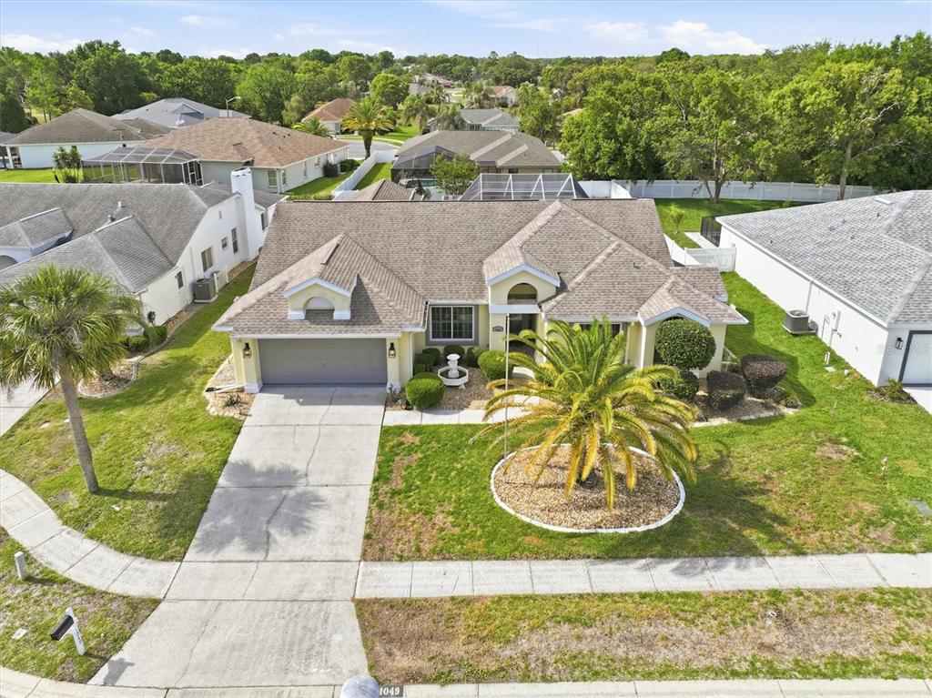 1049 Larkin Road Spring Hill, FL 34608 - Photo 6 of 64 a view of a house with a yard