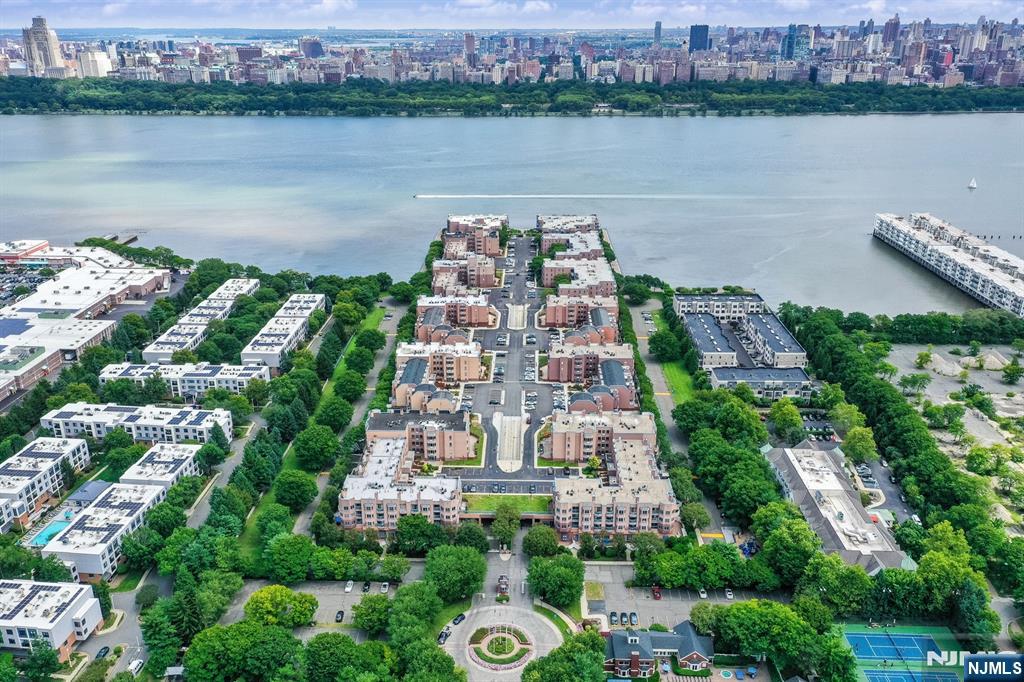 an aerial view of a house with a lake view