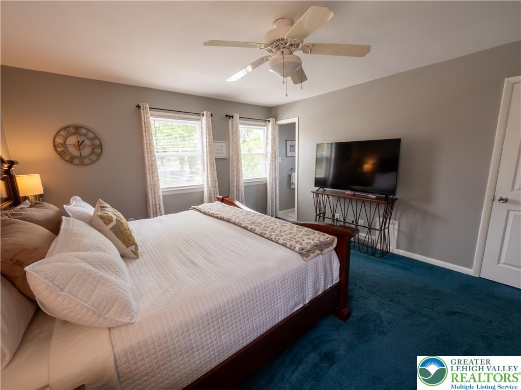 2087 Hopewell Road Bethlehem, PA 18017 - Photo 25 of 38 Relax in this tranquil bedroom, featuring plush carpeting and a cooling ceiling fan.