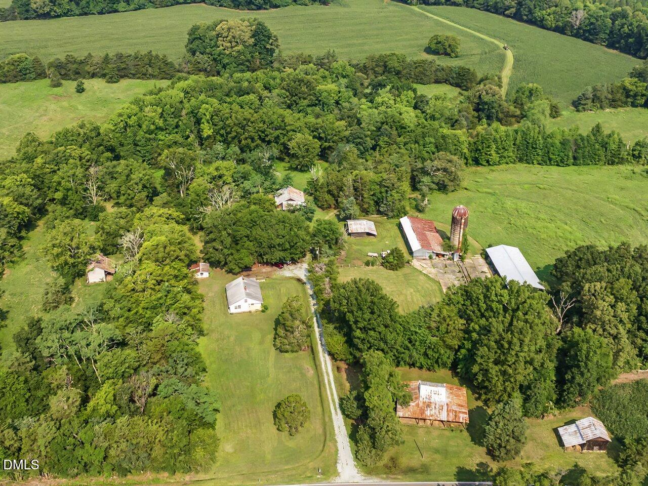 7793 Ridgeville Road Leasburg, NC 27291 - Photo 14 of 89 Historic barnyard in Summer