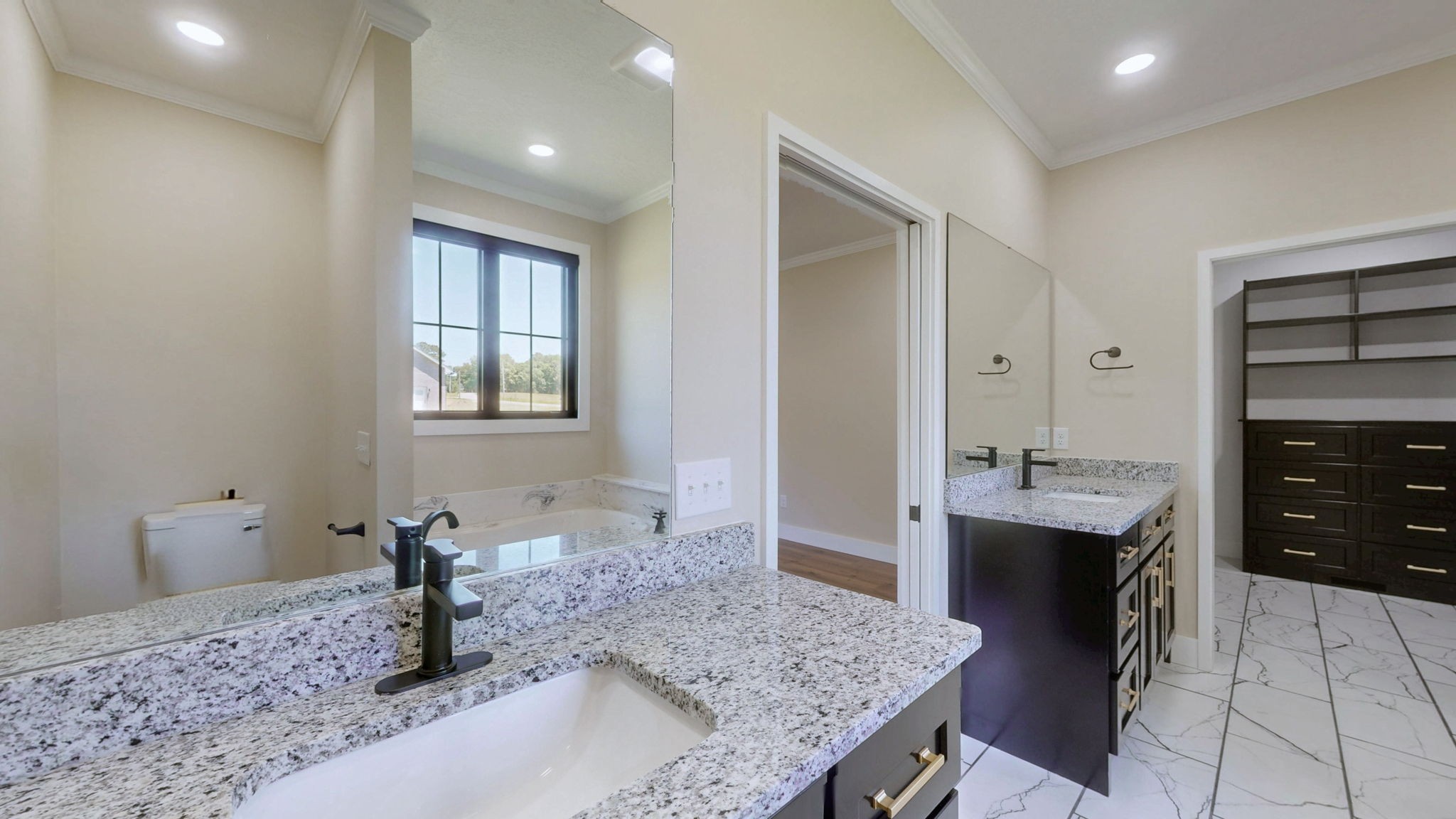 865 Alman Cemetery Road Paris, TN 38242 - Photo 16 of 41 a bathroom with a granite countertop sink and a mirror