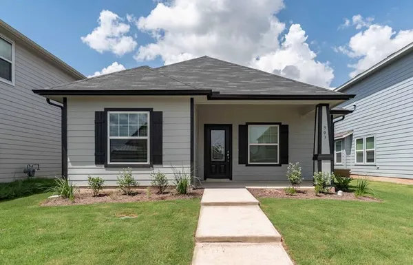 a front view of a house with yard