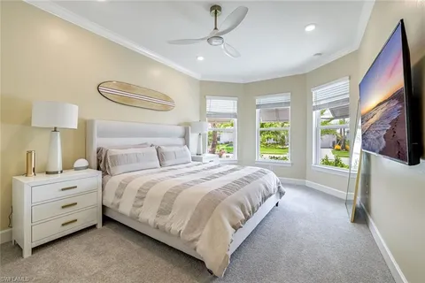 a bedroom with bed and a window