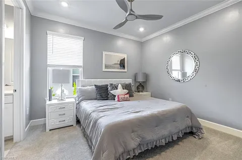 a living room with couch and a large window