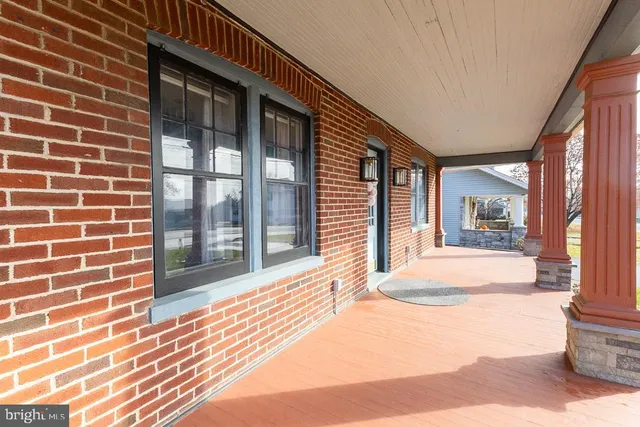 a view of an entryway with wooden floor and stairs
