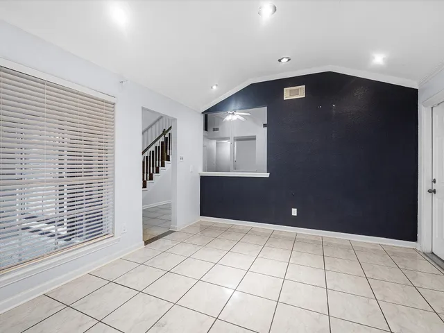 a view of an empty room with windows