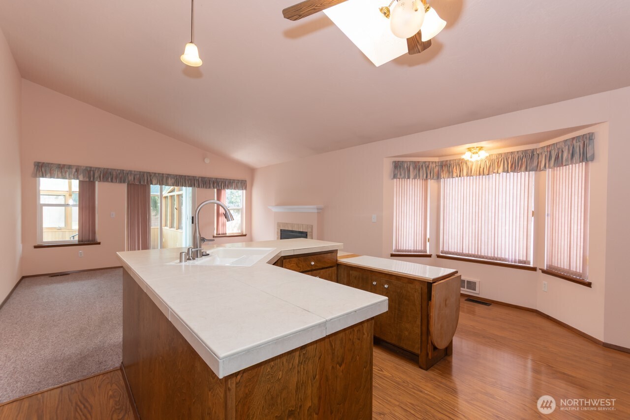 861 East Spruce Street Sequim, WA 98382 - Photo 12 of 39 a open kitchen with stainless steel appliances granite countertop a granite counter tops and a window