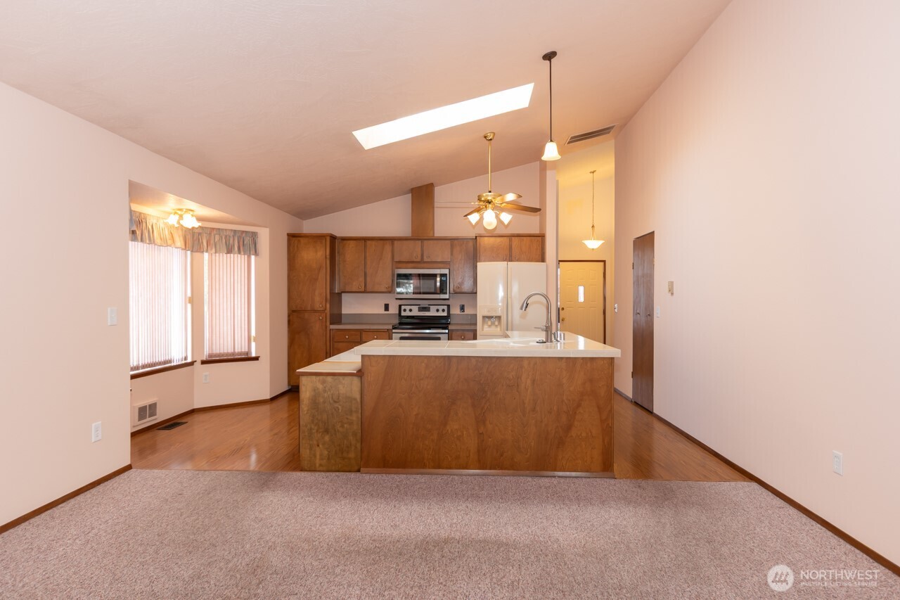 861 East Spruce Street Sequim, WA 98382 - Photo 13 of 39 a view of kitchen and kitchen with furniture