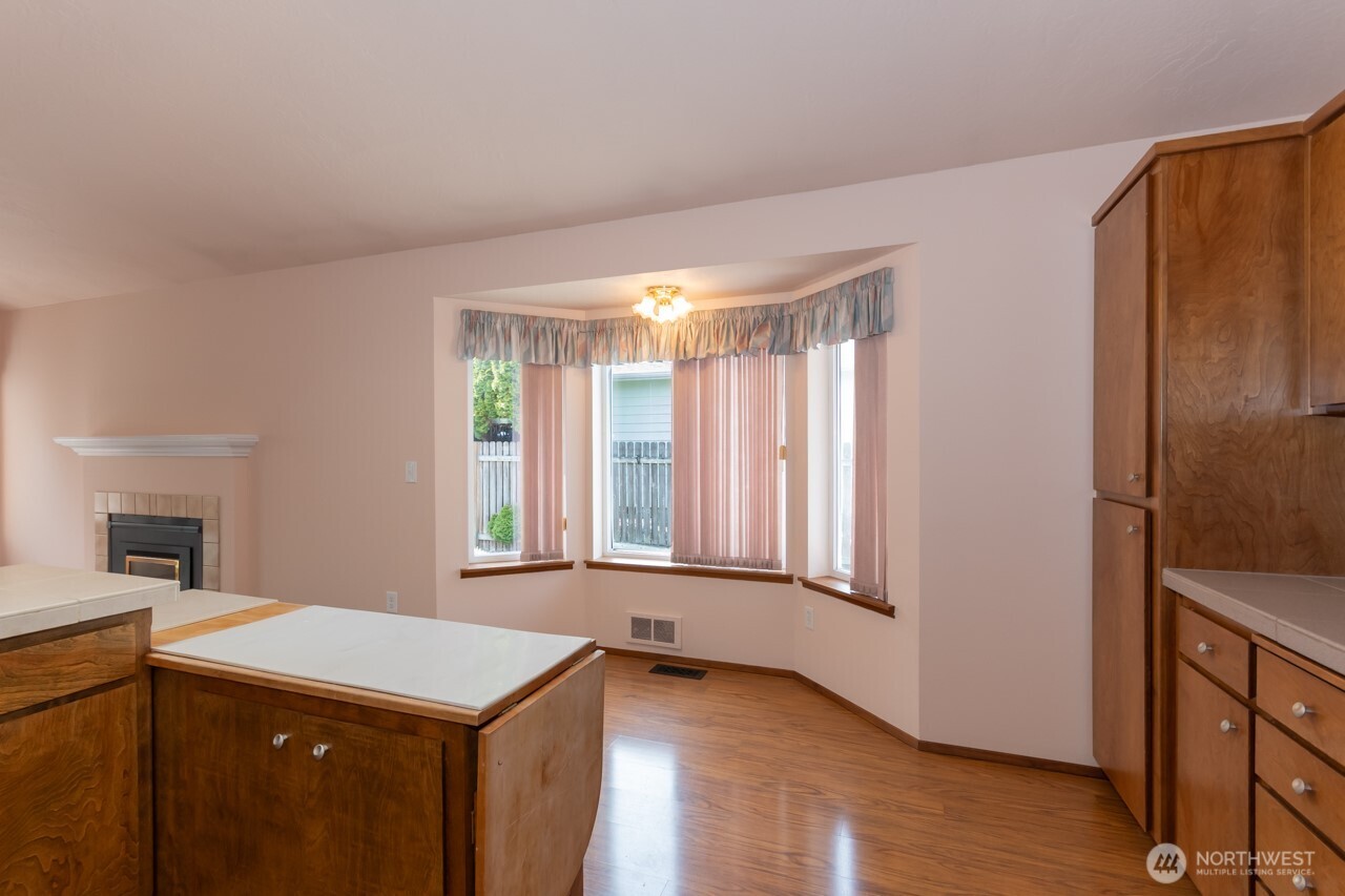 861 East Spruce Street Sequim, WA 98382 - Photo 14 of 39 a view of an empty room with window and wooden floor