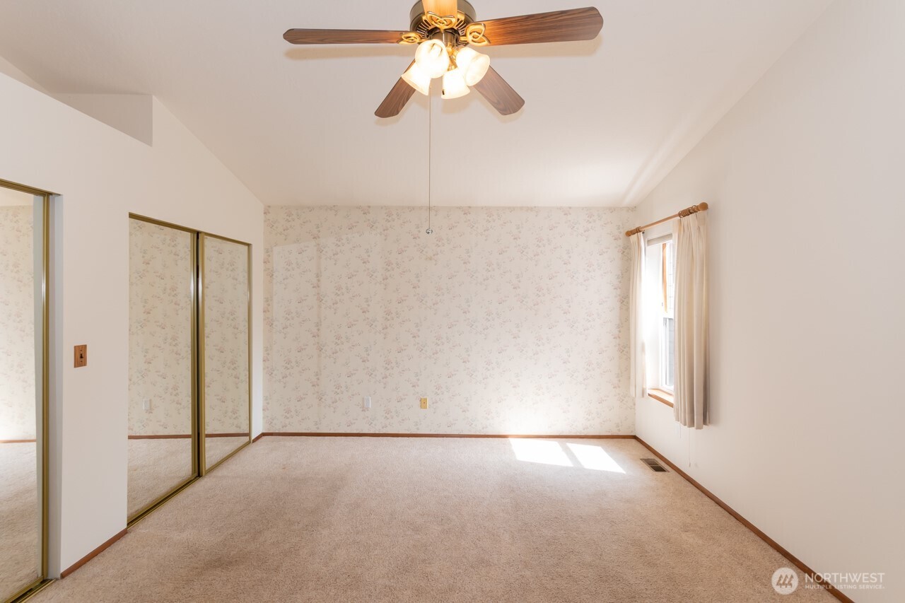 861 East Spruce Street Sequim, WA 98382 - Photo 21 of 39 an empty room with windows and fan