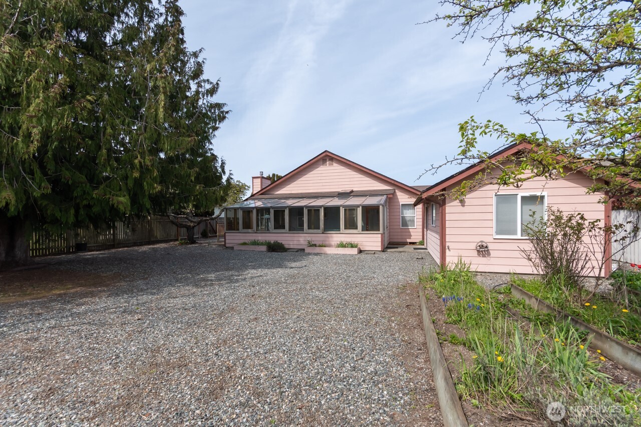 861 East Spruce Street Sequim, WA 98382 - Photo 30 of 39 a front view of a house with garden