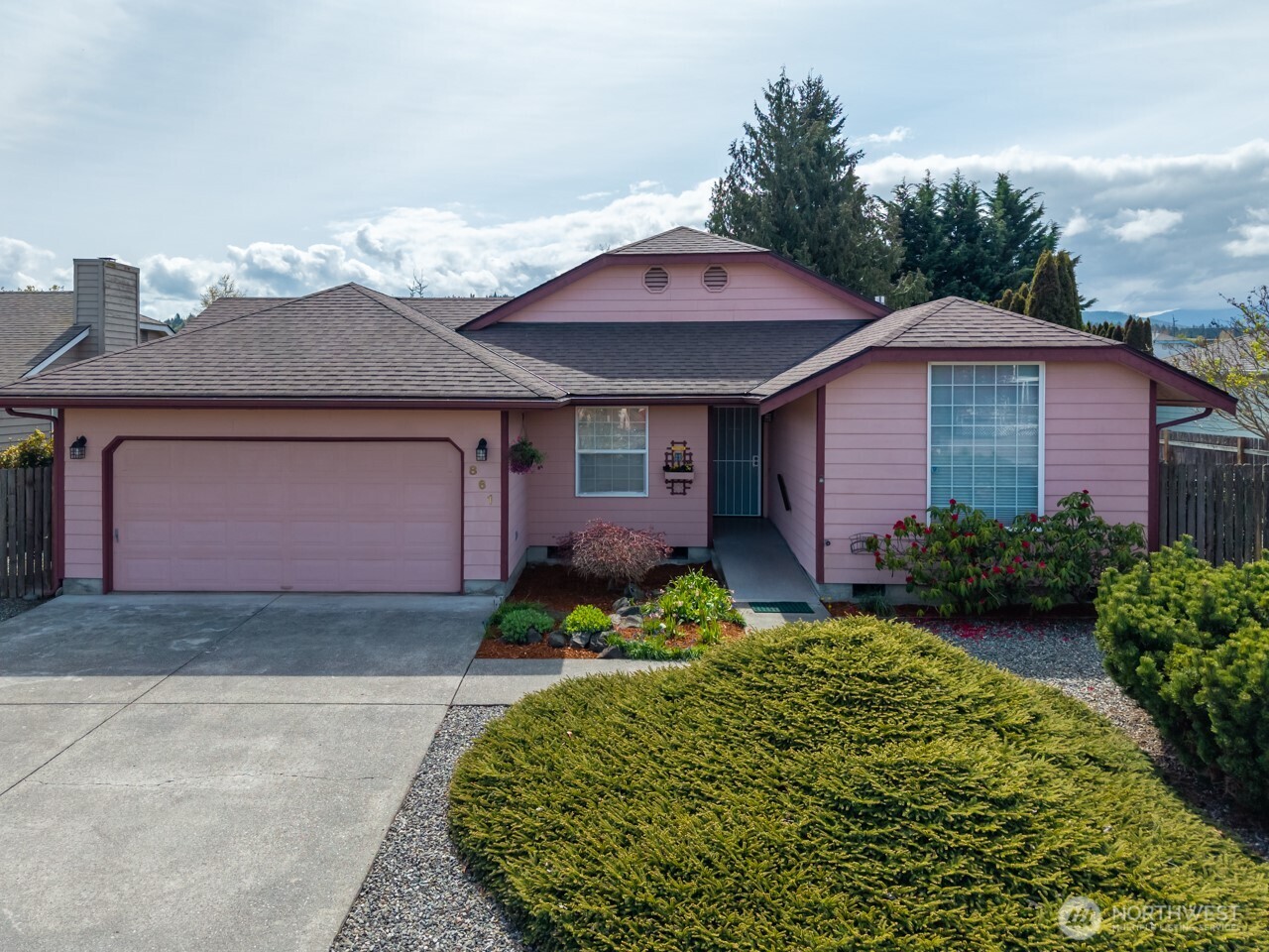 861 East Spruce Street Sequim, WA 98382 - Photo 39 of 39 a front view of a house with garden
