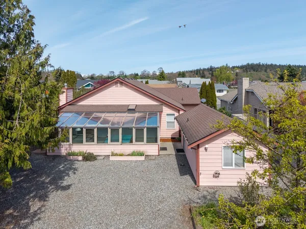 an aerial view of a house with a yard and balcony