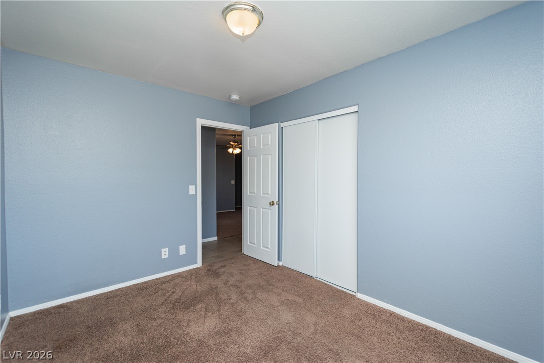 1444 Star Road Pahrump, NV 89048 - Photo 17 of 37 Smooth plaster walls and plush wall-to-wall carpeting define this comfortable bedroom space.