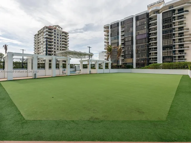 a view of a building with a yard