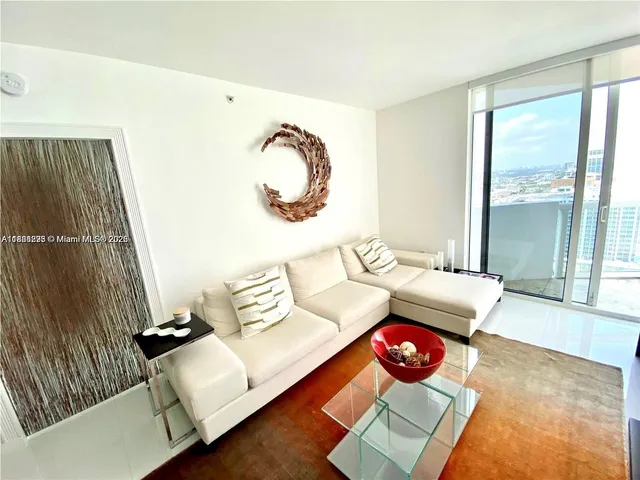 a living room with furniture and a window