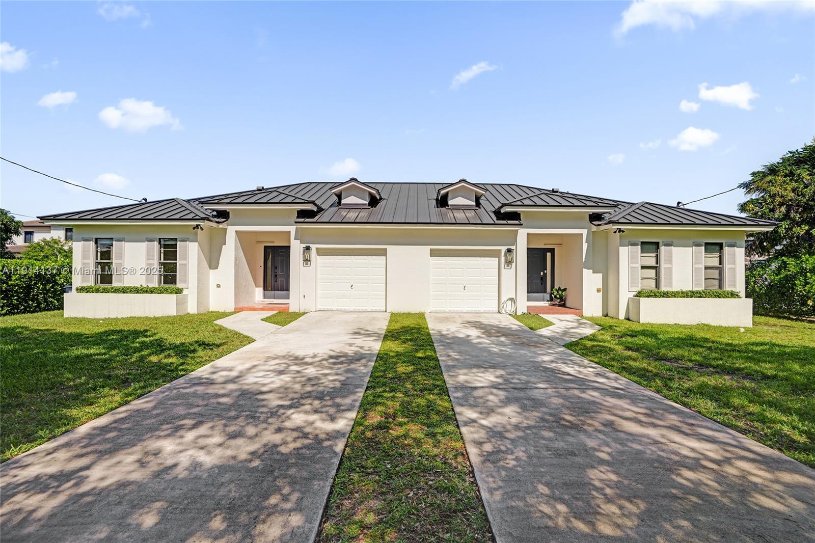 front view of a house with a yard