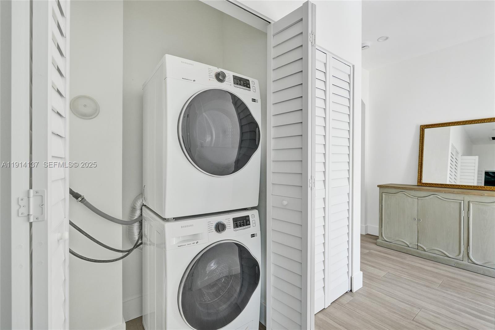 8371 Southwest 122nd Street Miami, FL 33156 - Photo 13 of 39 a view of a hallway with washer and dryer