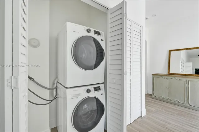 a view of a hallway with washer and dryer