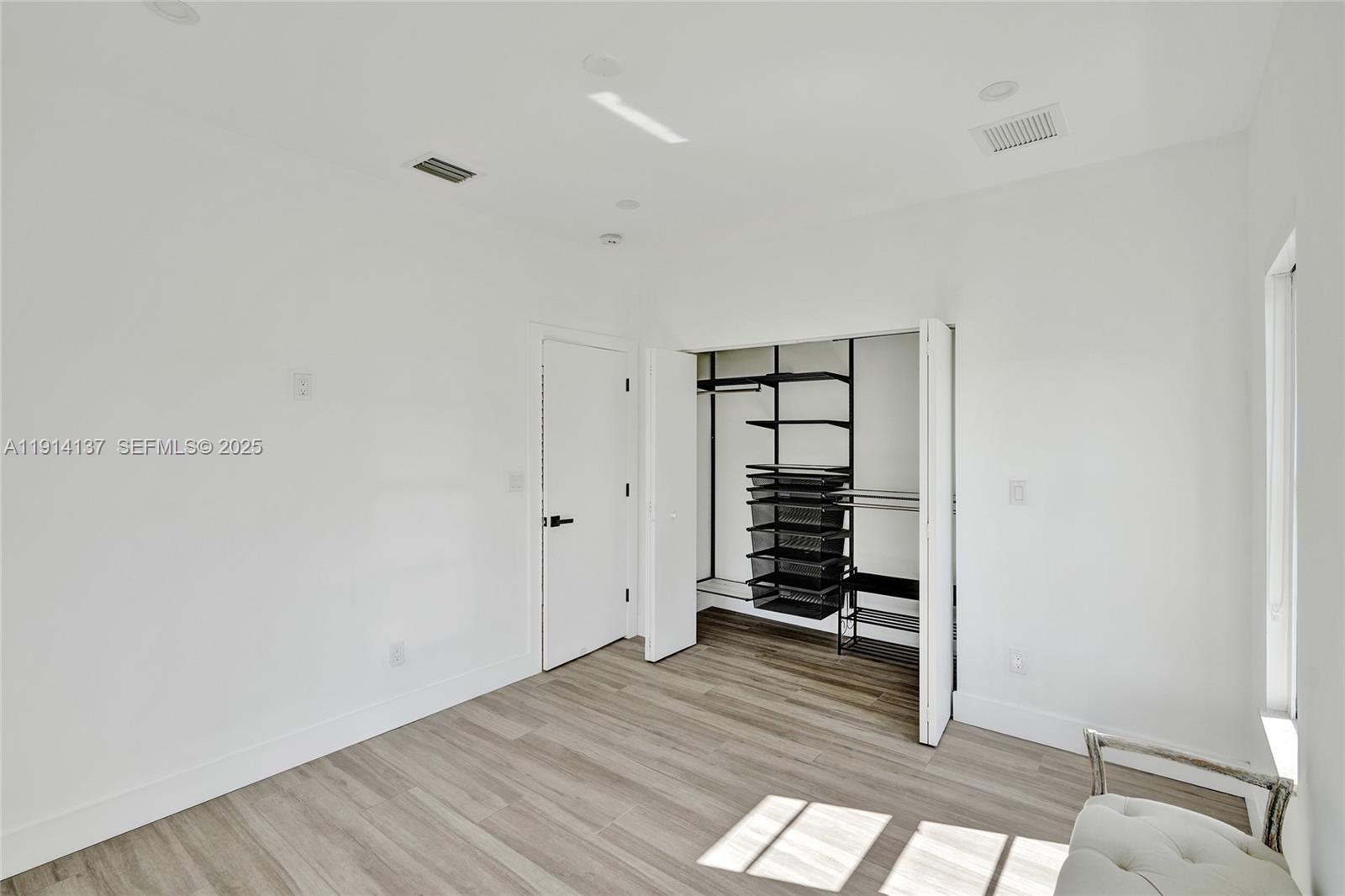 8371 Southwest 122nd Street Miami, FL 33156 - Photo 16 of 39 wooden floor in an empty room