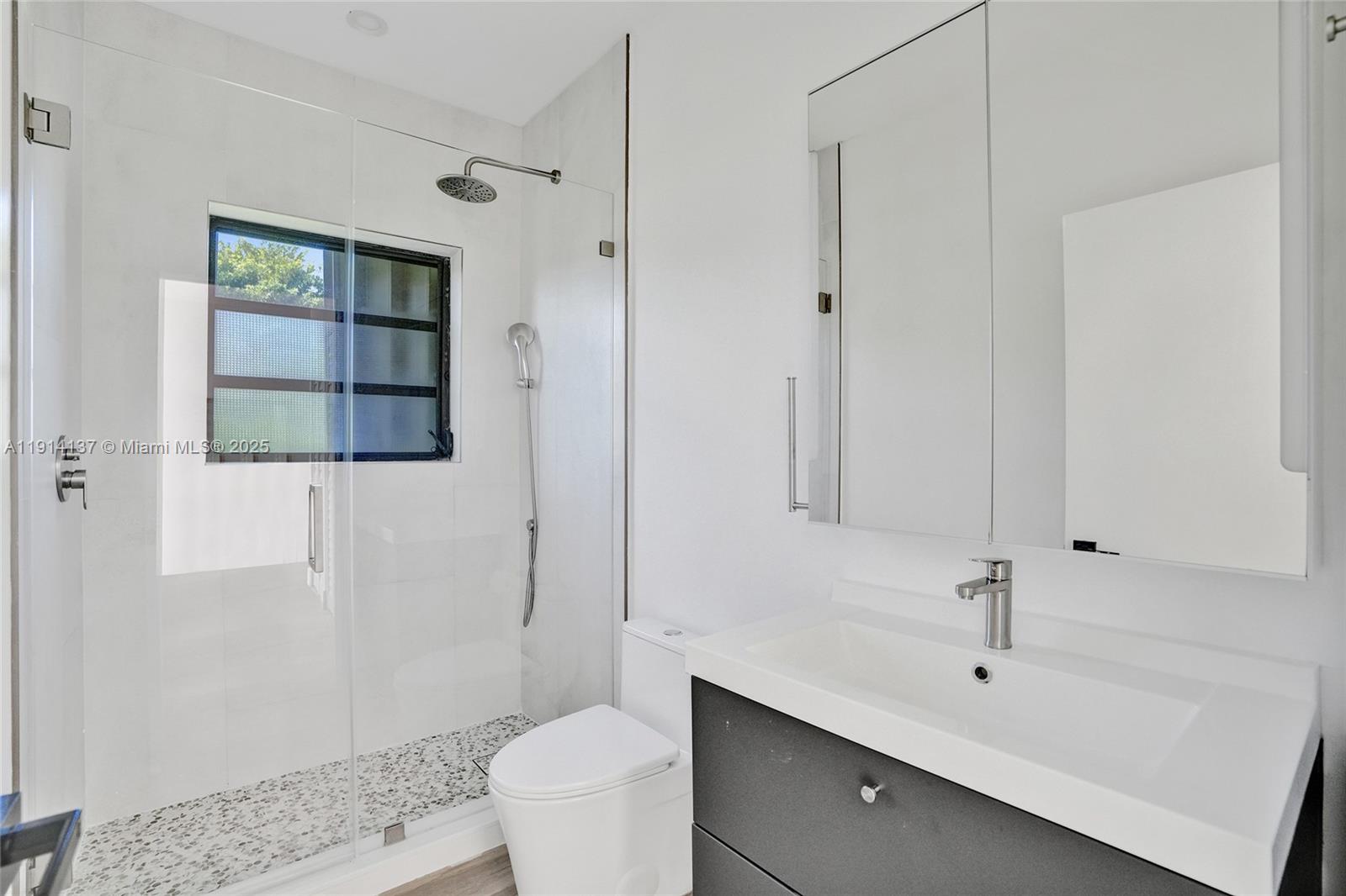8371 Southwest 122nd Street Miami, FL 33156 - Photo 18 of 39 a bathroom with a sink a toilet and shower