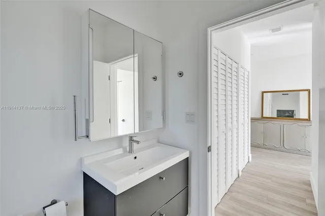 a bathroom with a sink and a mirror