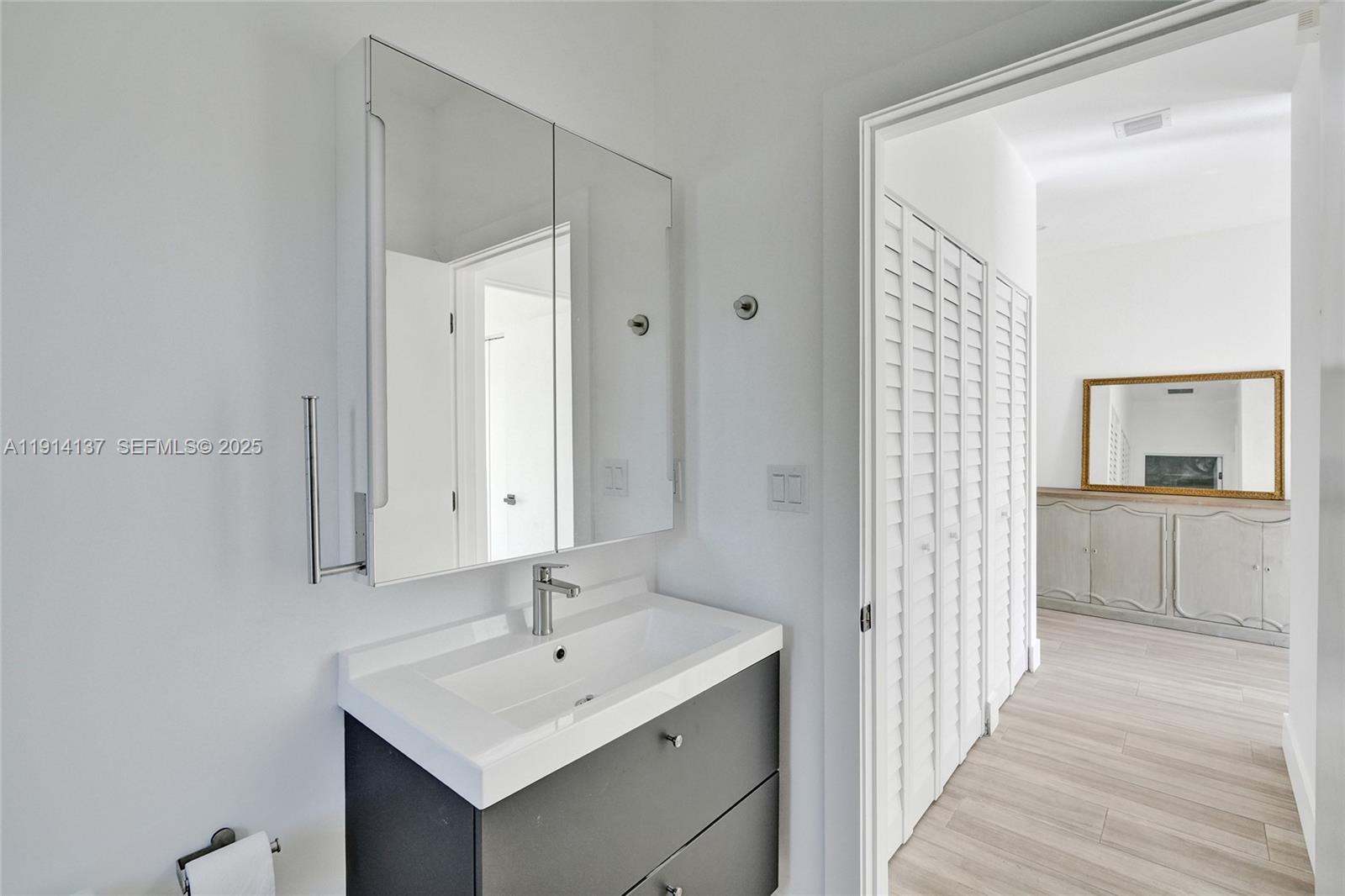 8371 Southwest 122nd Street Miami, FL 33156 - Photo 19 of 39 a bathroom with a sink and a mirror
