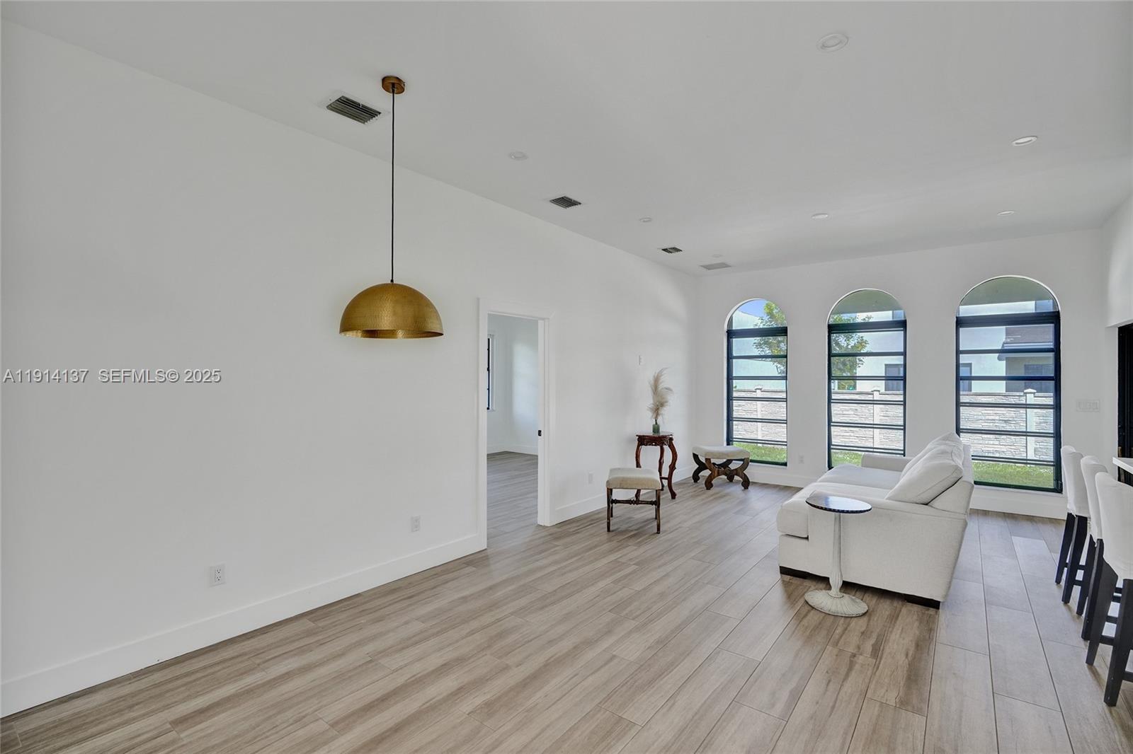 8371 Southwest 122nd Street Miami, FL 33156 - Photo 20 of 39 a living room with furniture and a wooden floor
