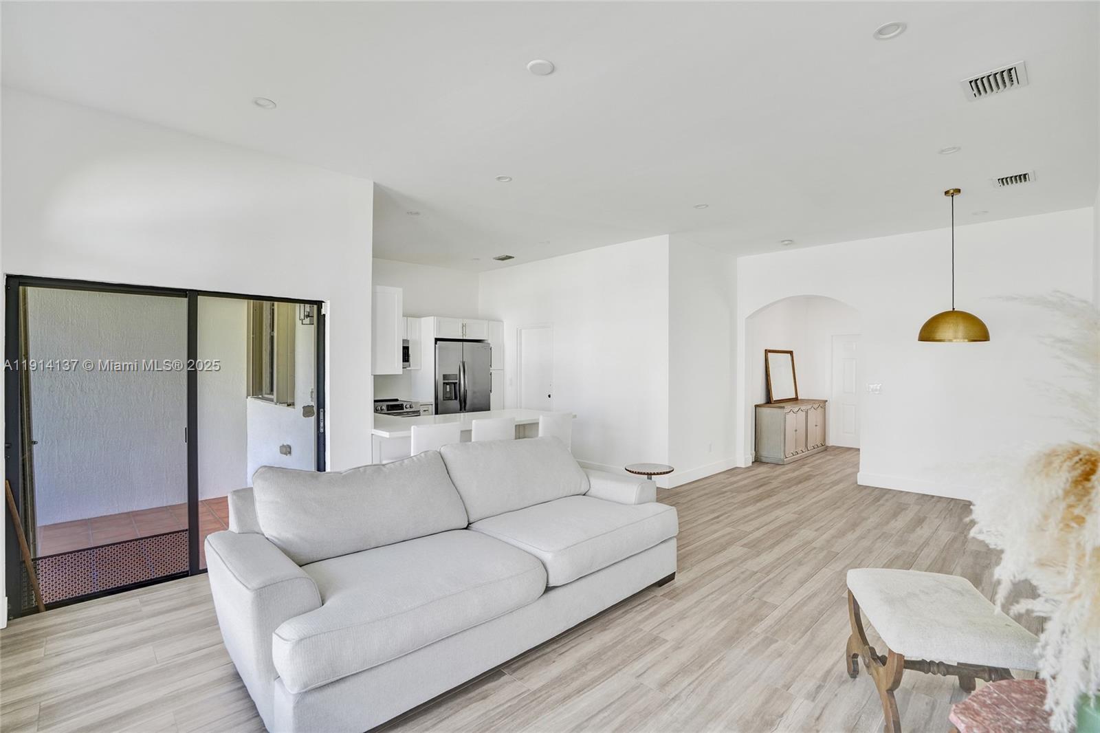8371 Southwest 122nd Street Miami, FL 33156 - Photo 28 of 39 a living room with furniture and a table
